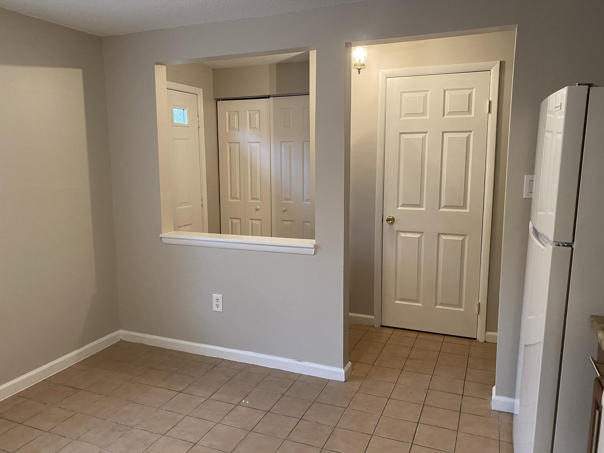 7717 Bernadette Lane Raleigh, NC 27615 - Photo 5 of 26 an empty room with windows and closet area