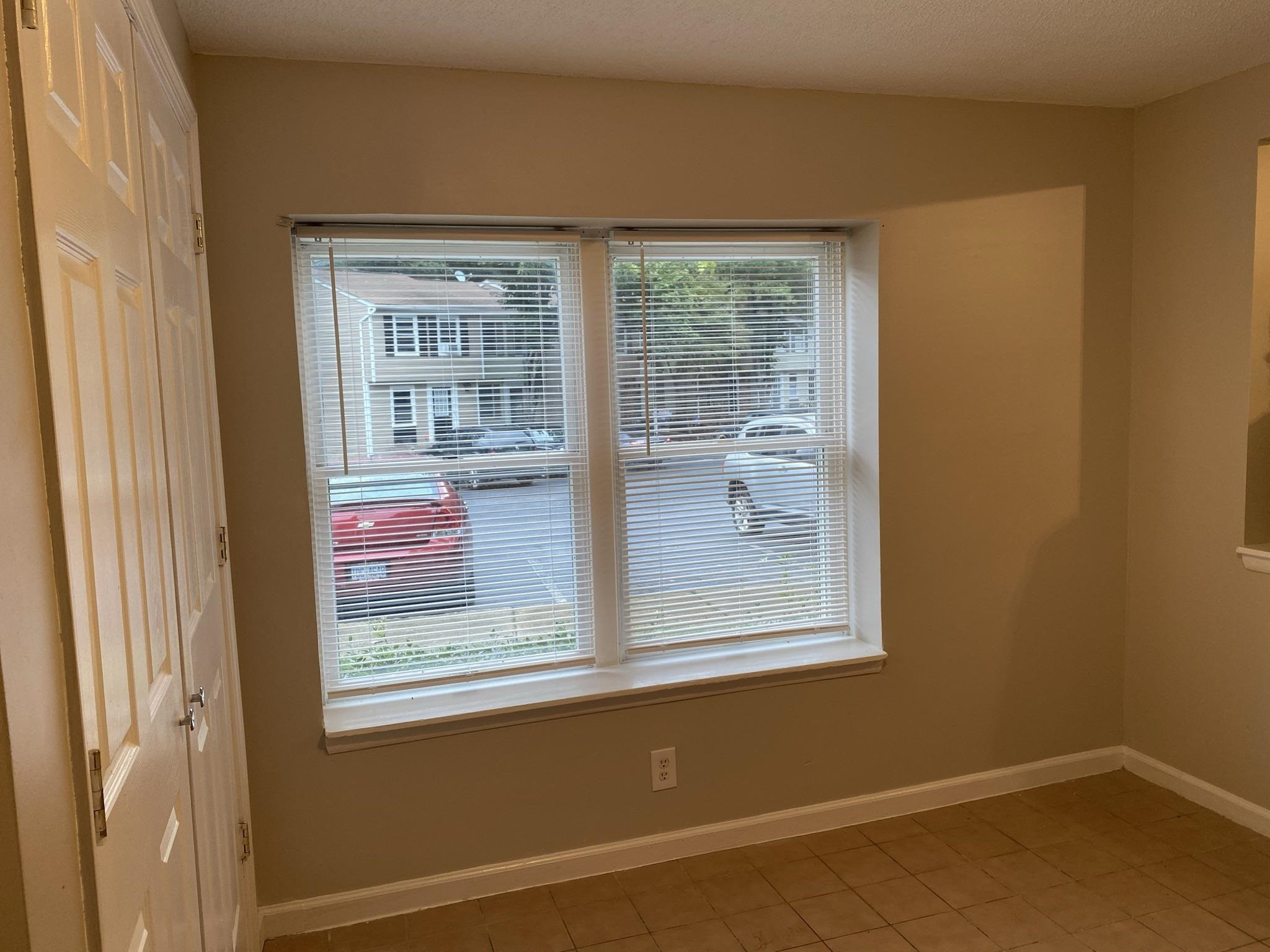 7717 Bernadette Lane Raleigh, NC 27615 - Photo 9 of 26 a view of a room that has a window in it