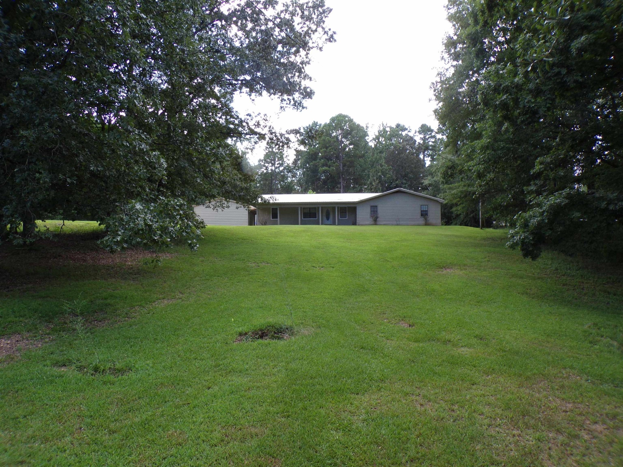 75 Friends Road Potts Camp, MS 38659 - Photo 4 of 28 a view of a house with a backyard