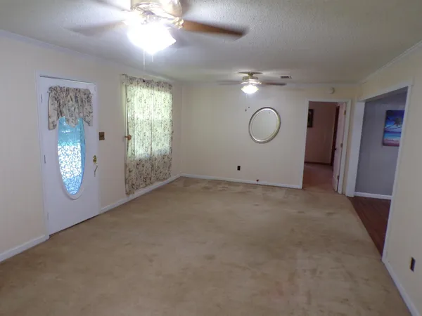 a view of a room with window and bathroom