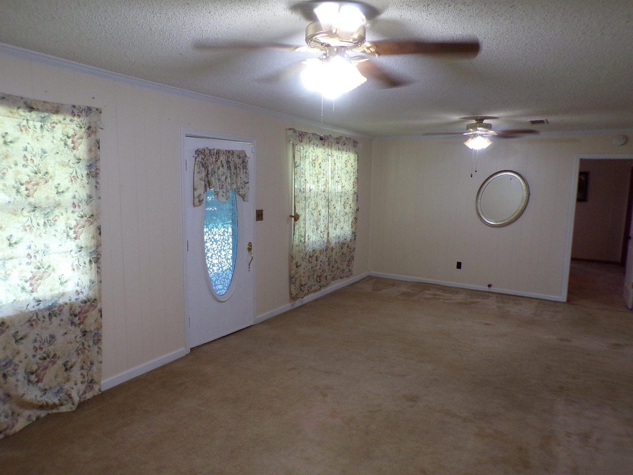 75 Friends Road Potts Camp, MS 38659 - Photo 10 of 28 en empty room with windows and ceiling fan
