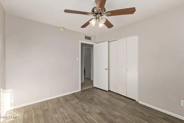 an empty room with wooden floor