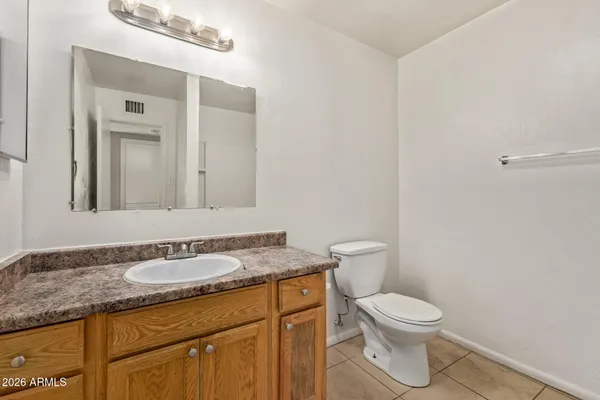 a bathroom with a toilet and bathtub