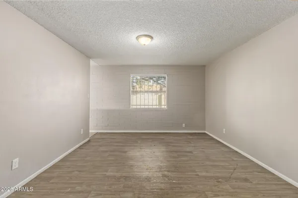 a view of an empty room with a window