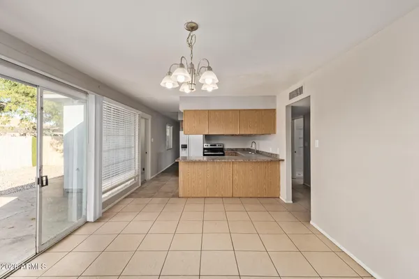 a kitchen with stainless steel appliances granite countertop a refrigerator sink and cabinets