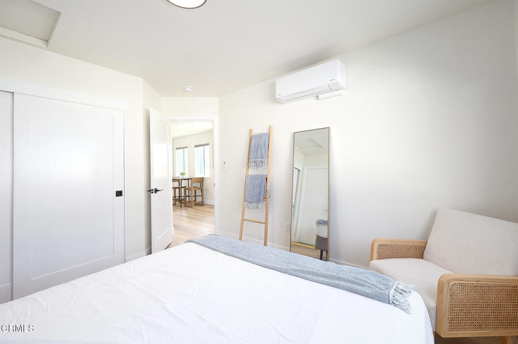 97 Everett Street, Unit B Moorpark, CA 93021 - Photo 21 of 28 a bedroom with a bed and a mirror