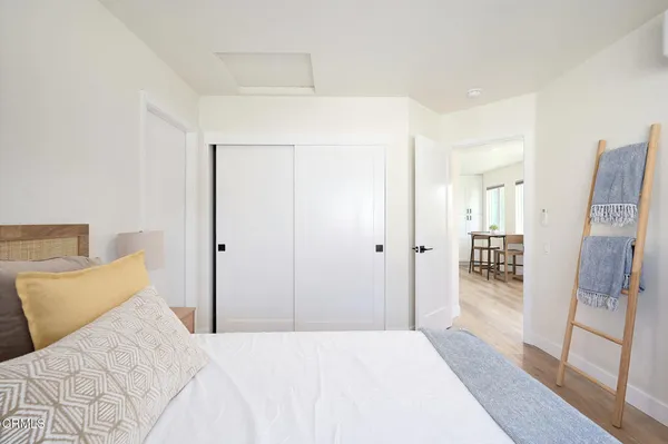 a bedroom with a bed and a furniture