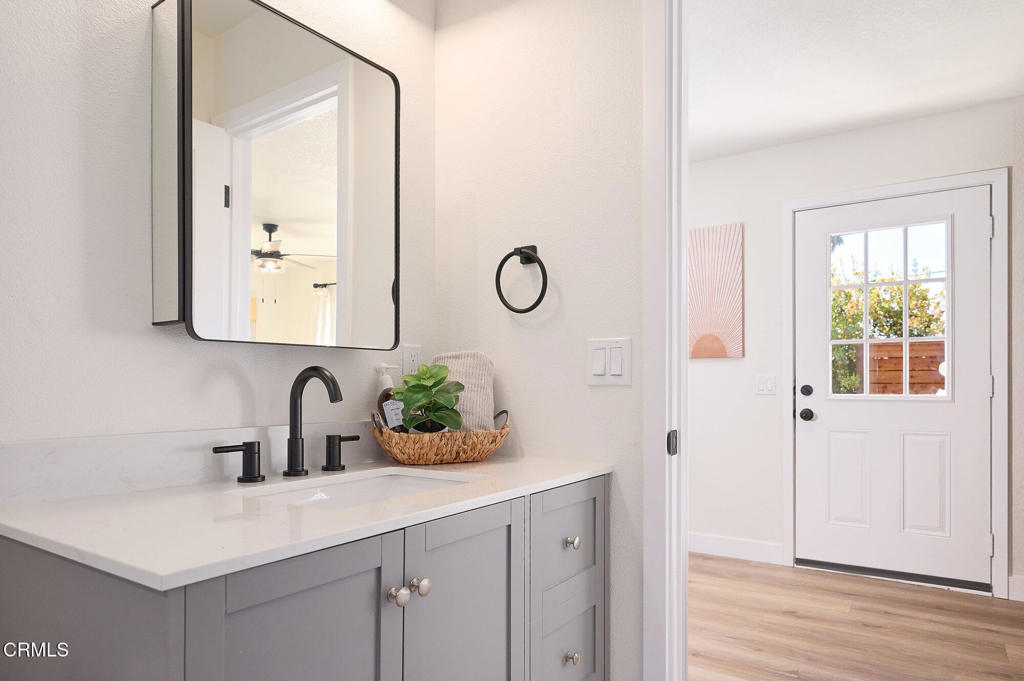 97 Everett Street, Unit B Moorpark, CA 93021 - Photo 25 of 28 a bathroom with a sink and a mirror