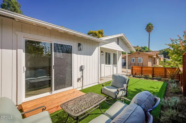 a backyard of a house with seating space