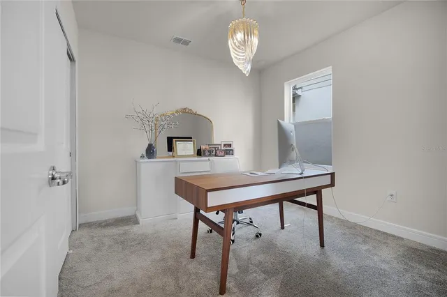 a view of a workspace with furniture