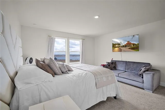 a bedroom with a bed and a couch