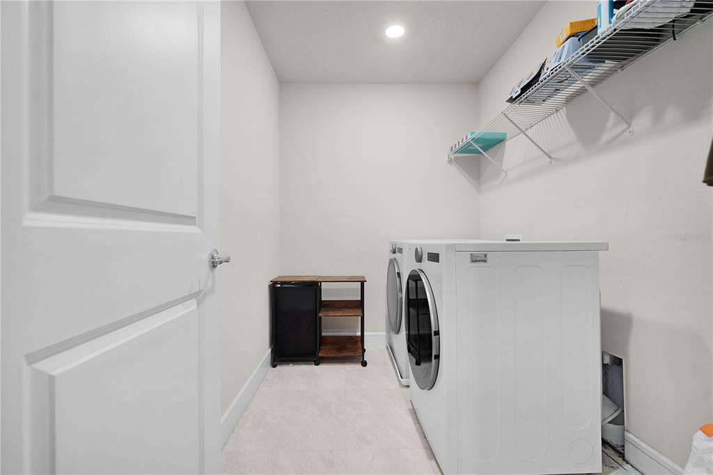 7379 Catania Loop Clermont, FL 34714 - Photo 29 of 37 a utility room with dryer and washer