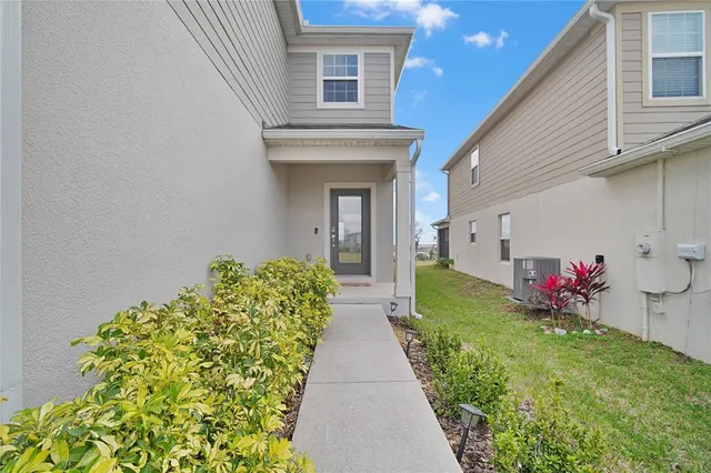 a view of a house with a flower garden