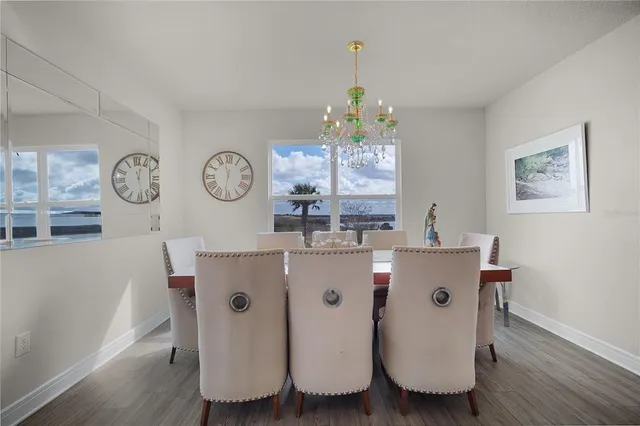 a living room with table and chairs