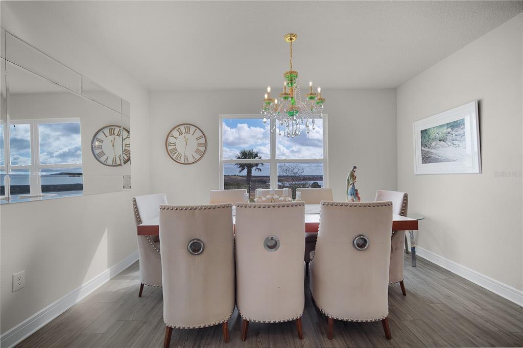 7379 Catania Loop Clermont, FL 34714 - Photo 10 of 37 a living room with table and chairs
