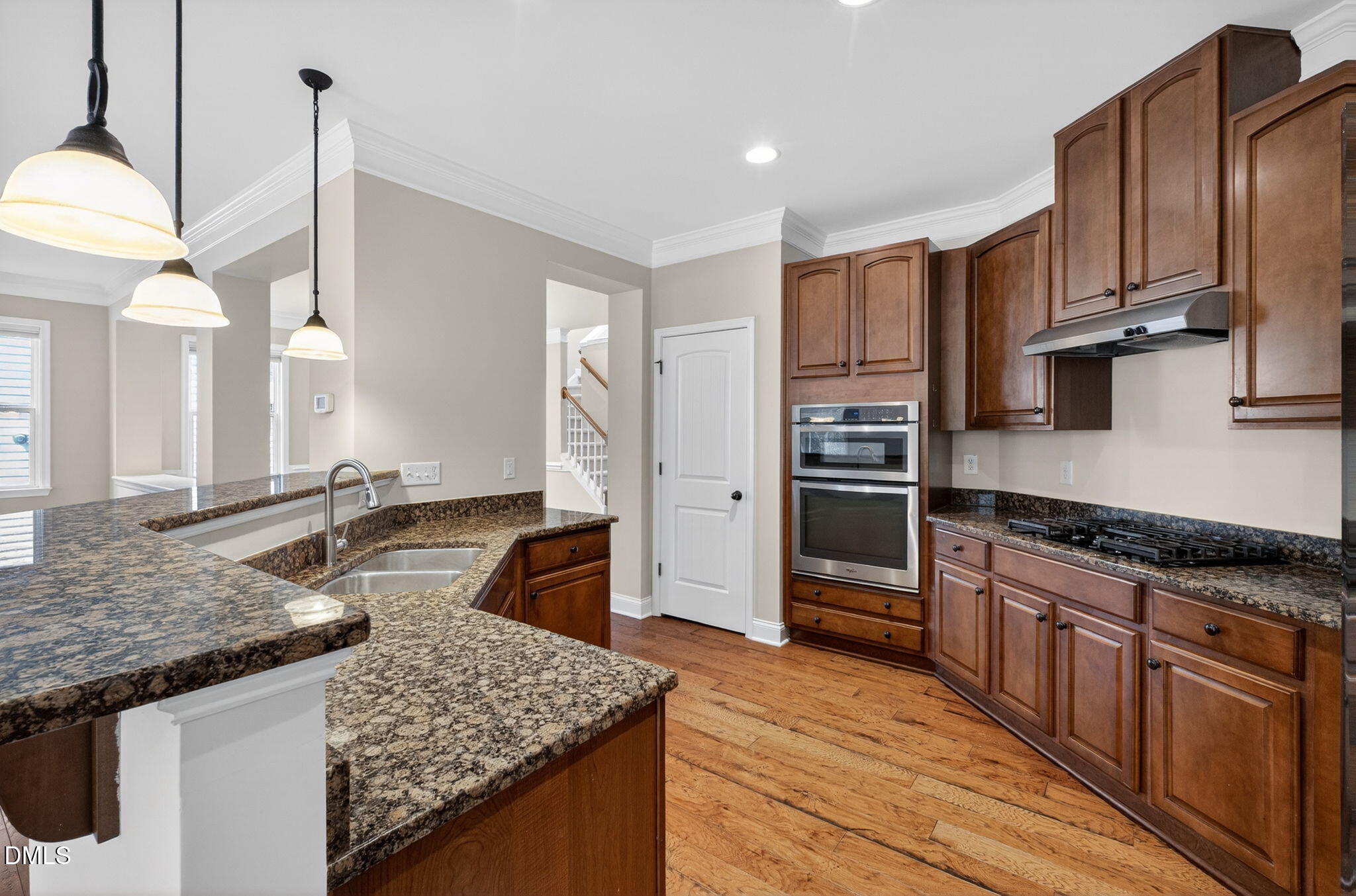 1304 Barnford Mill Road Wake Forest, NC 27587 - Photo 11 of 44 a kitchen with stainless steel appliances granite countertop a sink stove and refrigerator