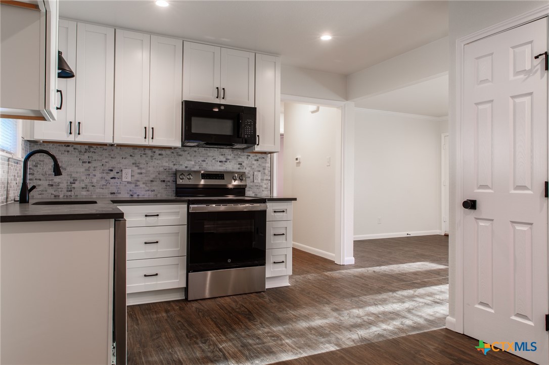 2019 South 9th Street Temple, TX 76504 - Photo 10 of 23 Lots of cabinets and pantry space.