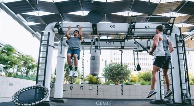 a view of living room filled with furniture and flat screen tv