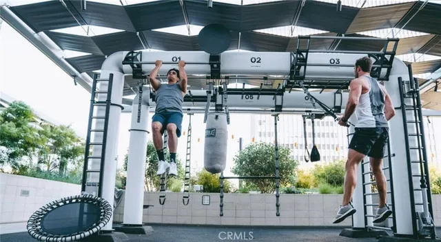 a view of living room filled with furniture and flat screen tv