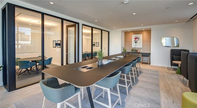 a front view of a house with a tree