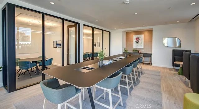 a front view of a house with a tree