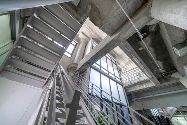 a room with water heater and a wooden floor