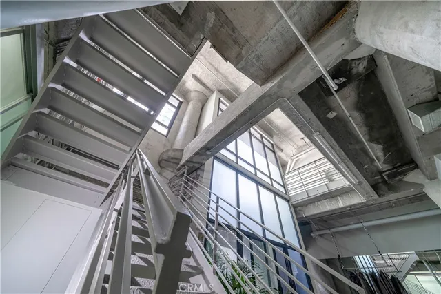 a room with water heater and a wooden floor