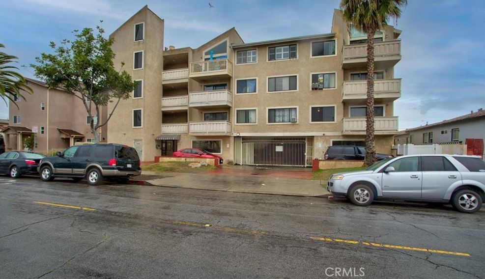 1723 Cedar Avenue, Unit 102 Long Beach, CA 90813 - Photo 1 of 22 a view of a cars parked in front of a building