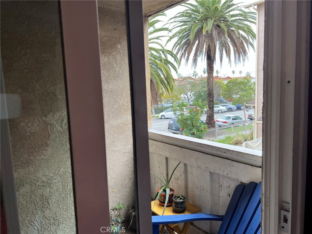1723 Cedar Avenue, Unit 102 Long Beach, CA 90813 - Photo 3 of 22 a view of a balcony with chair and floor to ceiling window