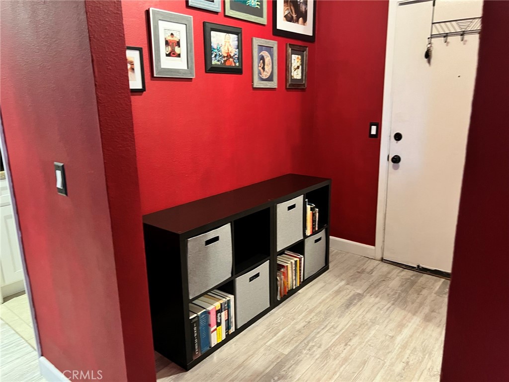 1723 Cedar Avenue, Unit 102 Long Beach, CA 90813 - Photo 4 of 22 a view of a hallway with wooden floor and staircase