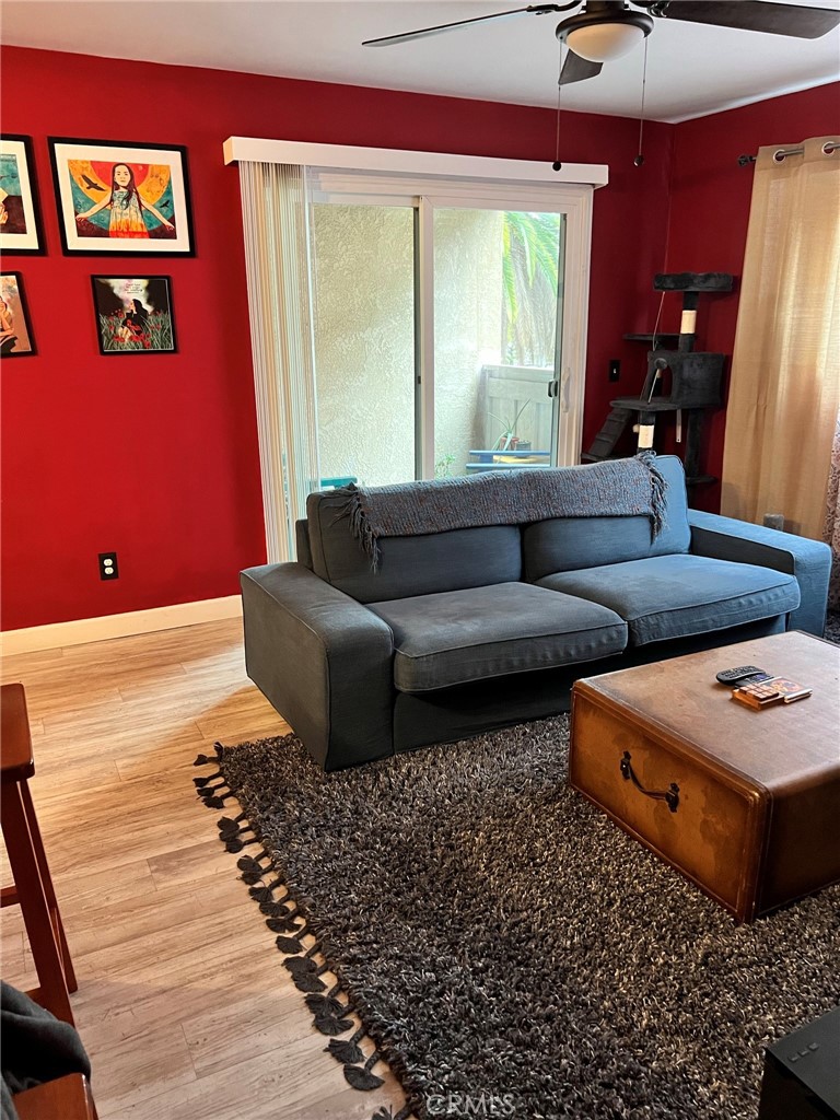 1723 Cedar Avenue, Unit 102 Long Beach, CA 90813 - Photo 5 of 22 a living room with furniture and a window