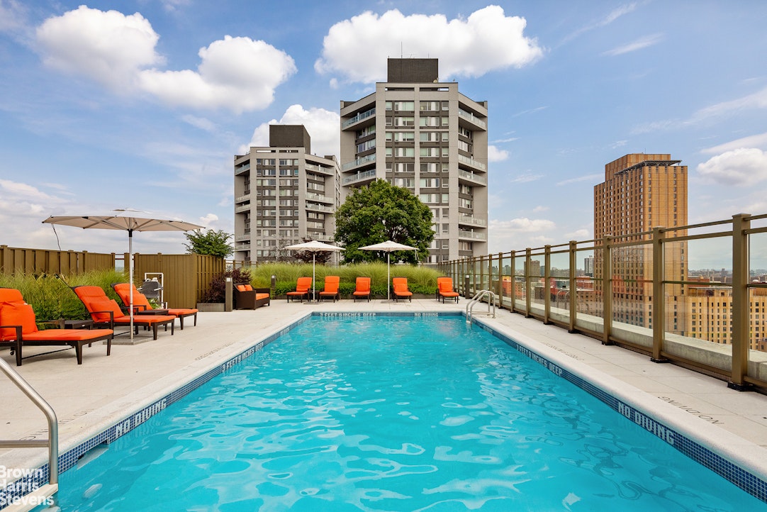 1280 5th Avenue, Unit 19C Manhattan, NY 10029 - Photo 14 of 20 a view of a swimming pool with sitting area