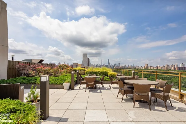 a view of a terrace with furniture