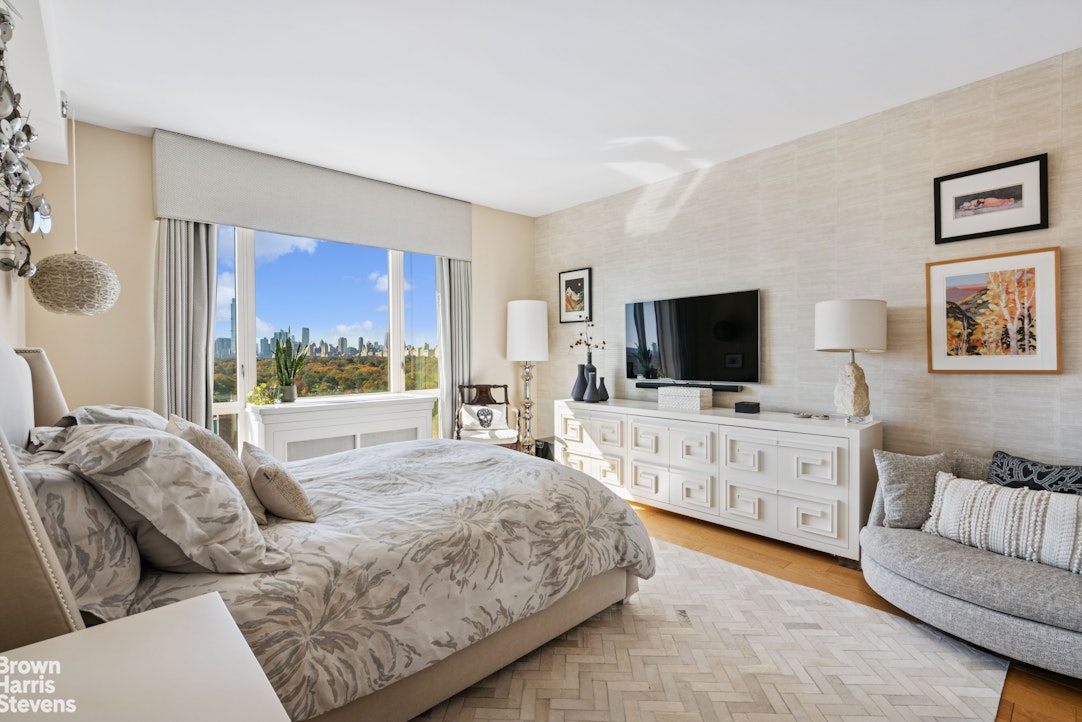 1280 5th Avenue, Unit 19C Manhattan, NY 10029 - Photo 7 of 20 a living room with furniture and a flat screen tv