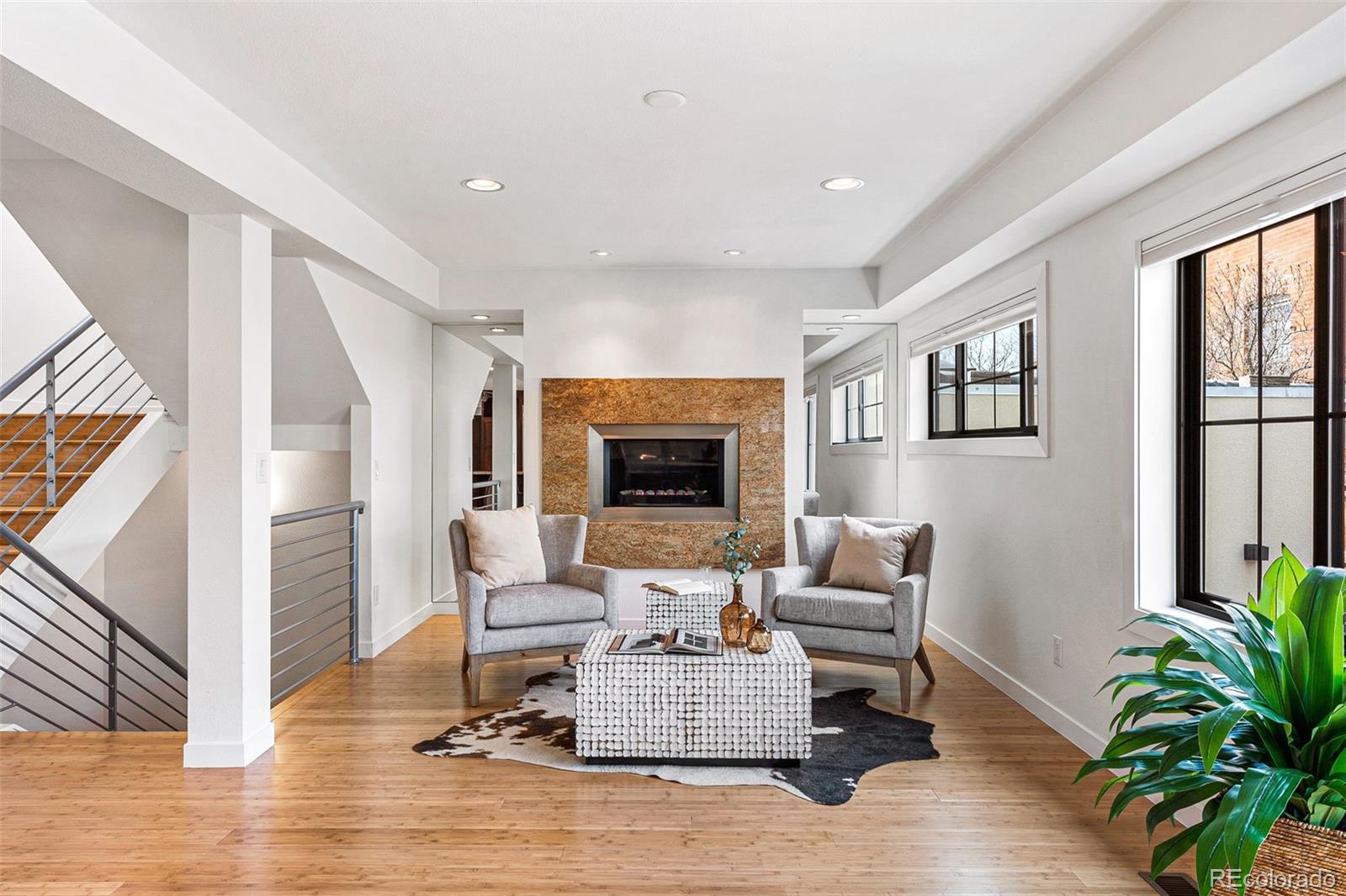 422 Cook Street Denver, CO 80206 - Photo 14 of 40 a living room with furniture and a fireplace