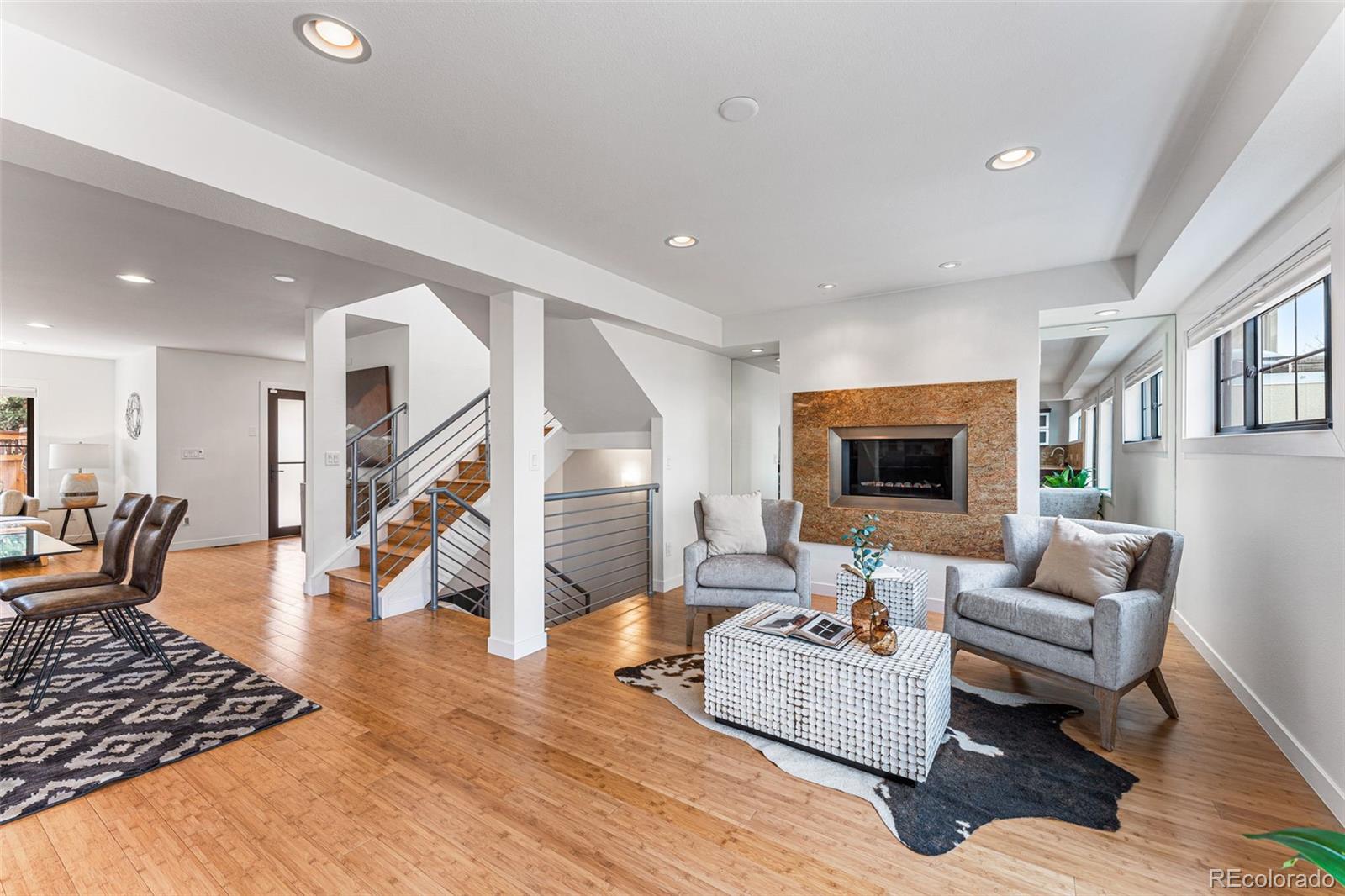 422 Cook Street Denver, CO 80206 - Photo 15 of 40 a living room with furniture and a wooden floor
