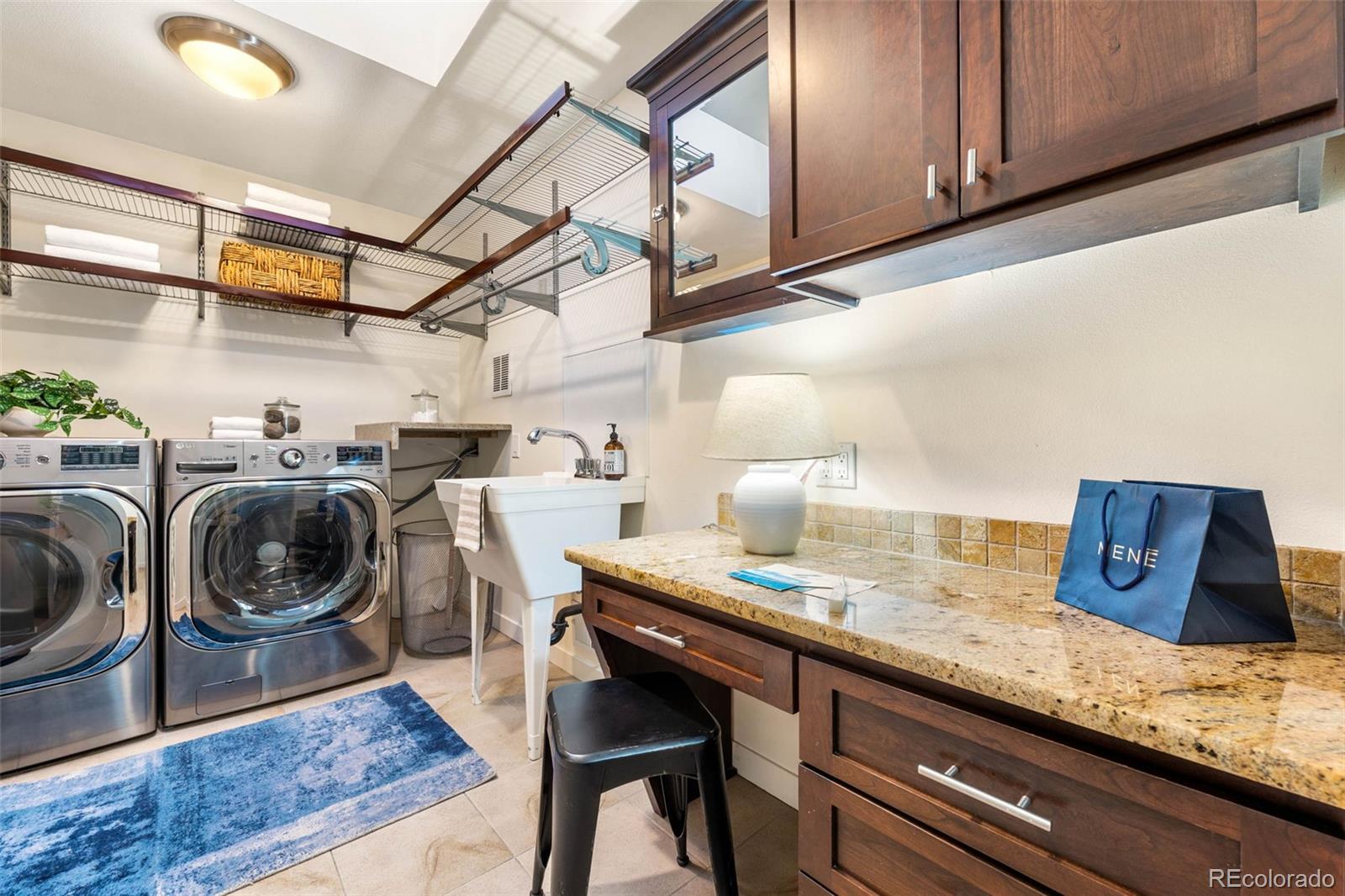 422 Cook Street Denver, CO 80206 - Photo 18 of 40 a view of a kitchen with sink dryer and washer