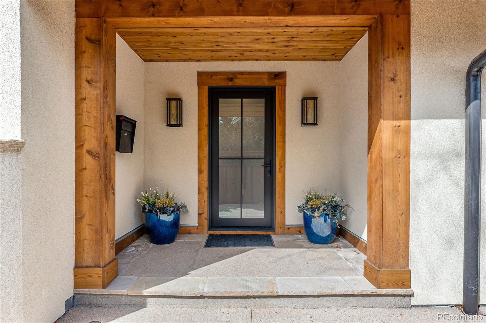422 Cook Street Denver, CO 80206 - Photo 2 of 40 a front view of a house with potted plants