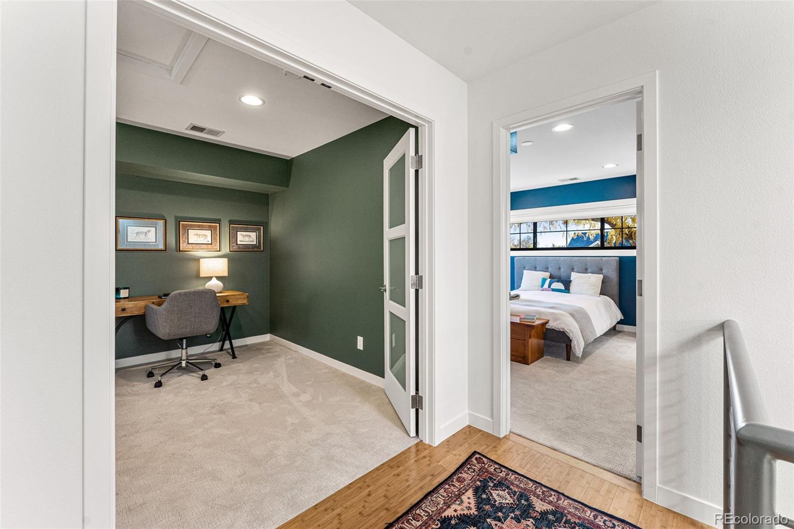 422 Cook Street Denver, CO 80206 - Photo 25 of 40 a view of a bedroom with a bed and a window
