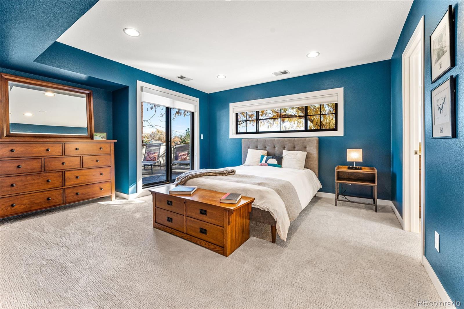 422 Cook Street Denver, CO 80206 - Photo 26 of 40 a bedroom with a bed and furniture