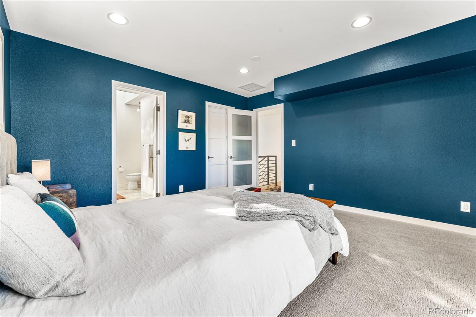 422 Cook Street Denver, CO 80206 - Photo 27 of 40 a bedroom with a large bed and closet