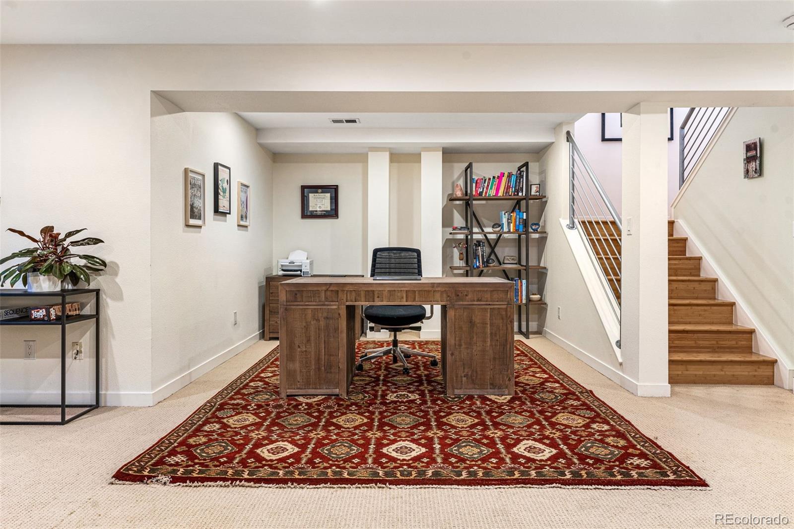 422 Cook Street Denver, CO 80206 - Photo 35 of 40 a living room with furniture and a rug