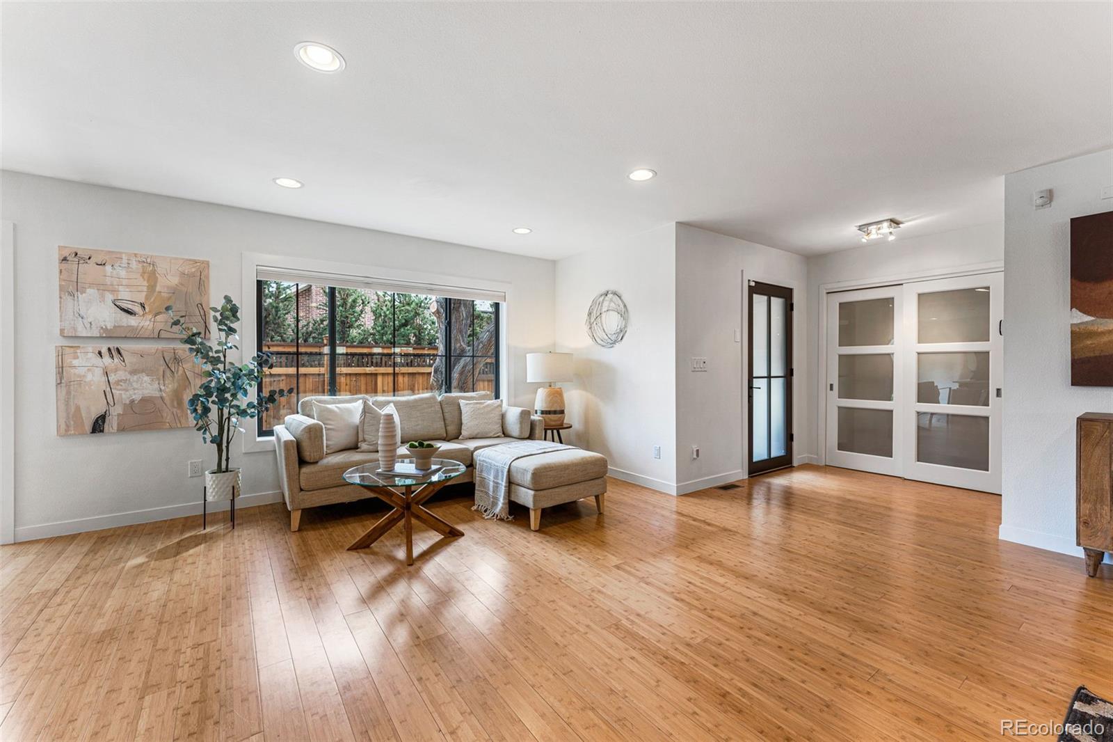 422 Cook Street Denver, CO 80206 - Photo 4 of 40 a living room with furniture and a wooden floor