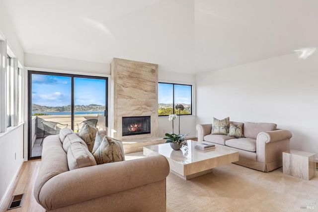a living room with furniture fireplace and a fireplace