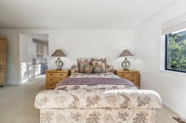 a bedroom with a bed and a dresser