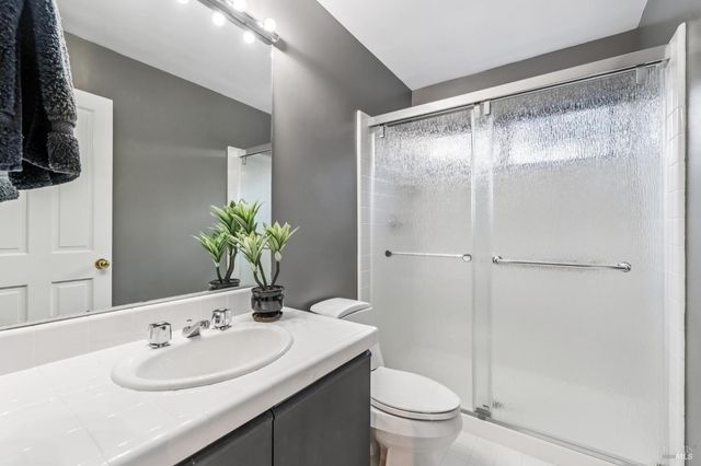 a bedroom with furniture and a large window