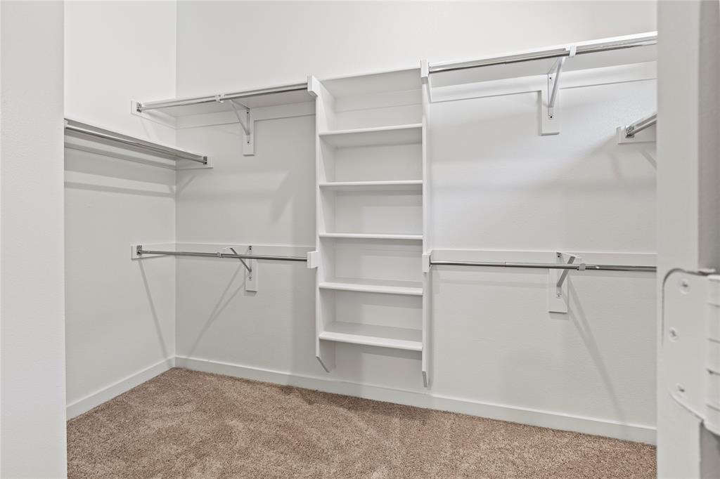 4005 High Valley McKinney, TX 75071 - Photo 12 of 18 a view of walk in closet with empty racks