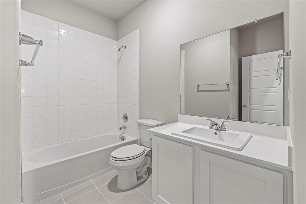 4005 High Valley McKinney, TX 75071 - Photo 14 of 18 a bathroom with a sink toilet and shower