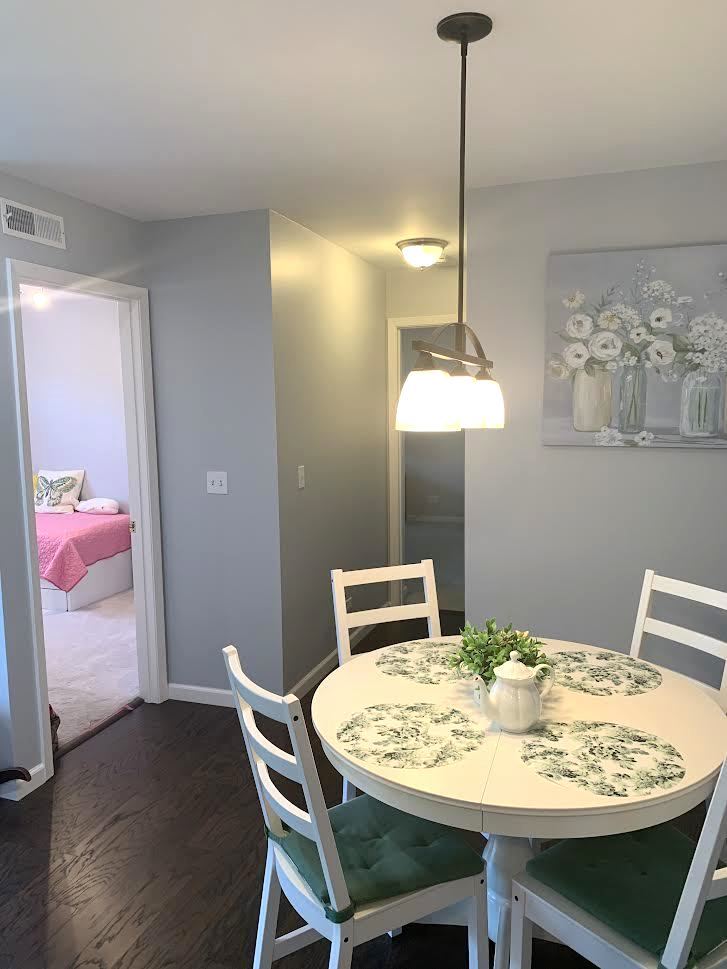810 North River Road, Unit 3C Mount Prospect, IL 60056 - Photo 12 of 21 a dining room with furniture and wooden floor