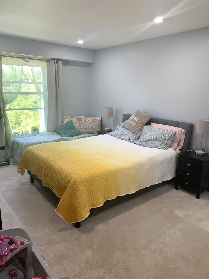810 North River Road, Unit 3C Mount Prospect, IL 60056 - Photo 14 of 21 a bed sitting in a bedroom next to a window